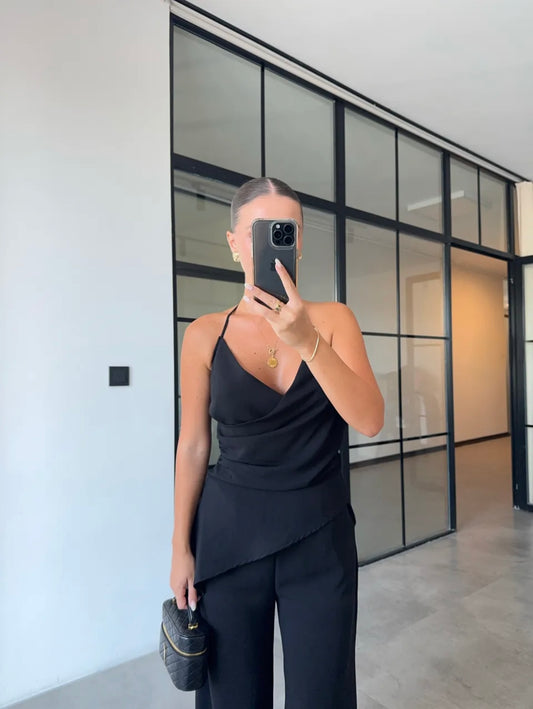 Black Draped Halter Neck Top Paired With Elegant Wide Leg Palazzo Trousers